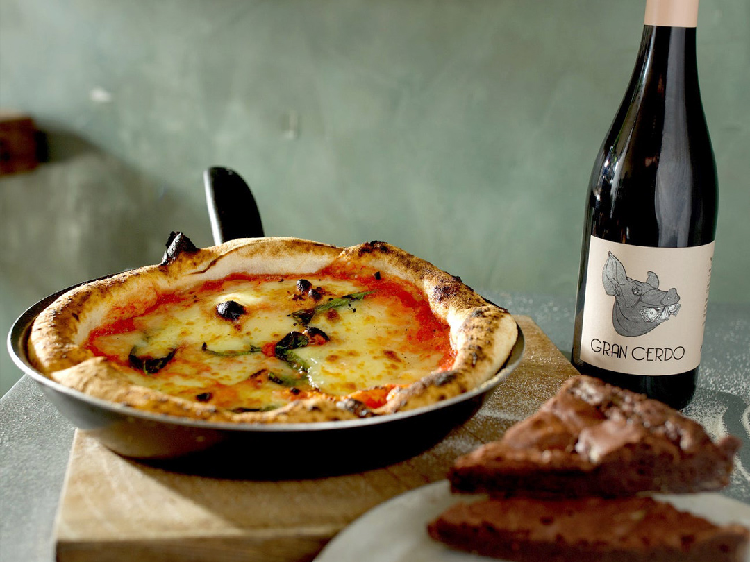Pizzarova make your kit margherita pizza in frying pan with bottle of red wine and chocolate brownies